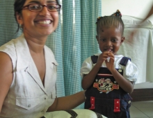 Portrait of Sumathi Sivapalasingam '90 and a child